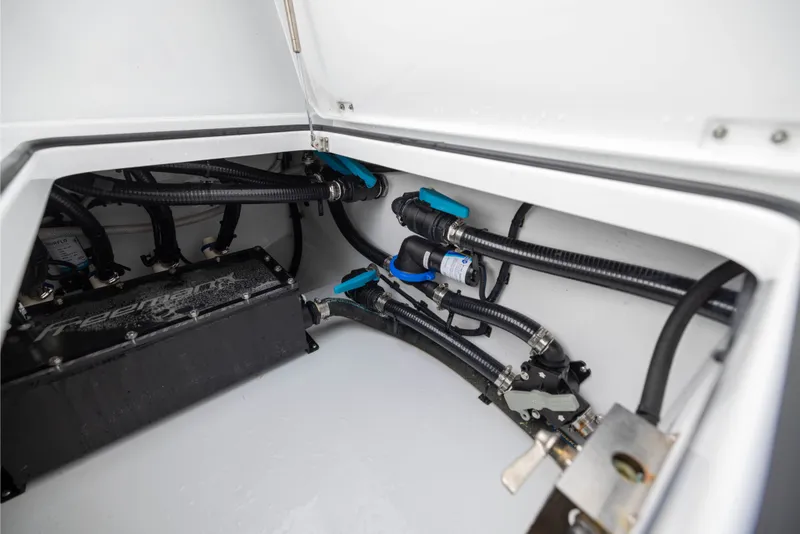 Slide: The Image of Engine compartment of a 2025 Freeman 35 boat, showcasing wiring and components. - 50