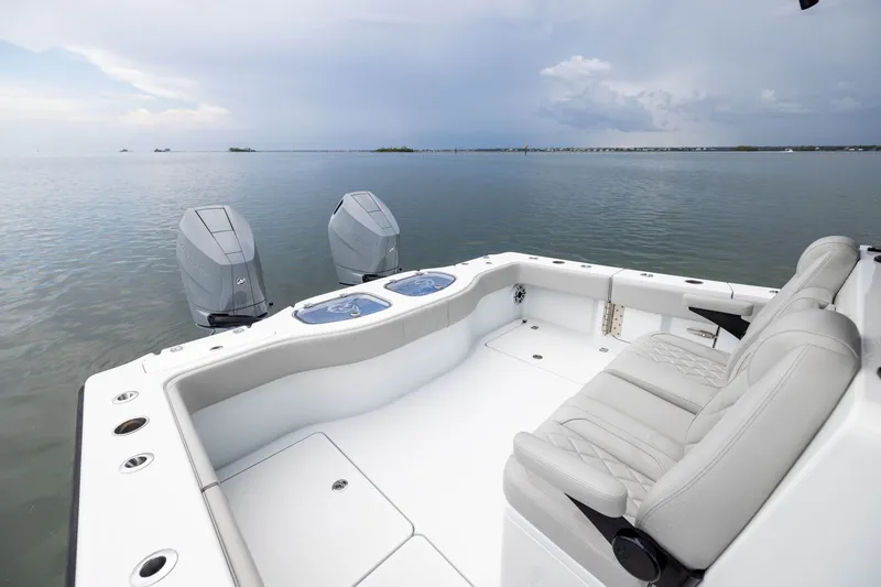 Slide: The Image of Freeman 35 boat, 2025 model, featuring dual engines and spacious seating on calm waters. - 44