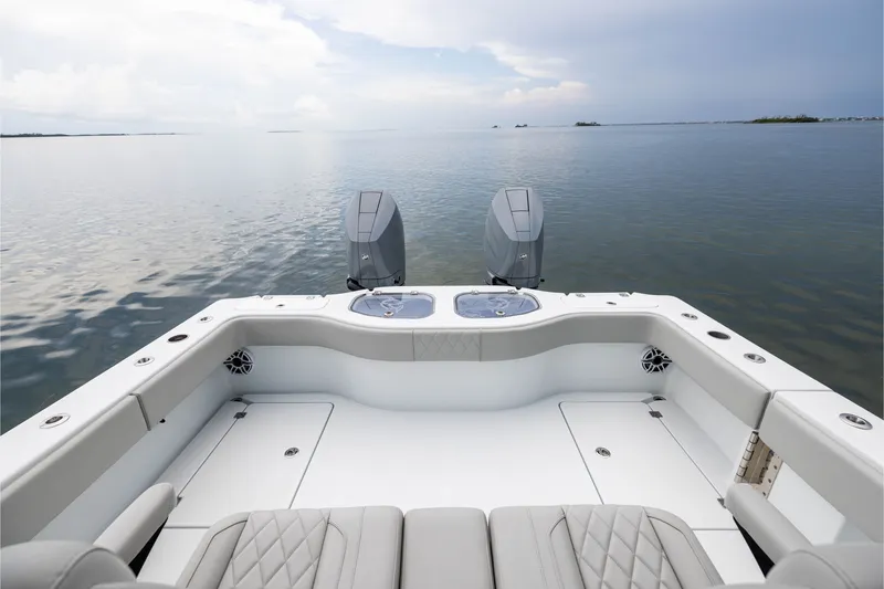 Slide: The Image of 2025 Freeman 35 boat with dual engines on calm water. - 43