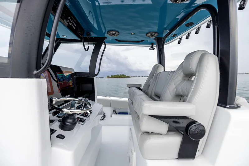 Slide: The Image of 2025 Freeman 35 boat interior with modern helm, plush seating, and advanced navigation system. - 28