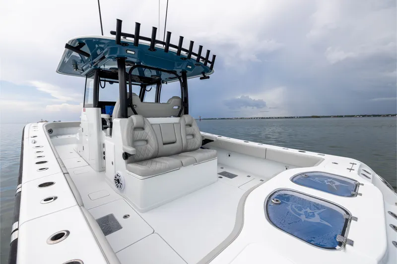 Slide: The Image of 2025 Freeman 35 boat with sleek design, spacious seating, and modern amenities on calm waters. - 41
