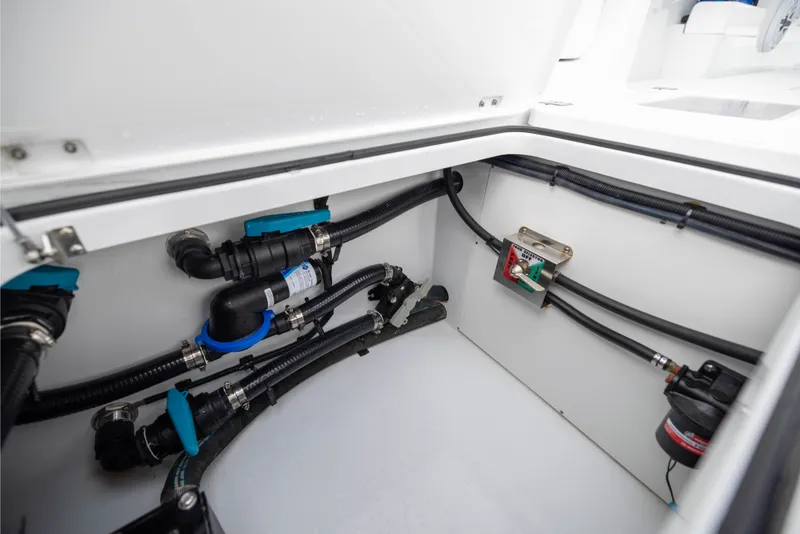 Slide: The Image of Freeman 35 (2025) boat compartment showcasing plumbing and wiring details. - 51