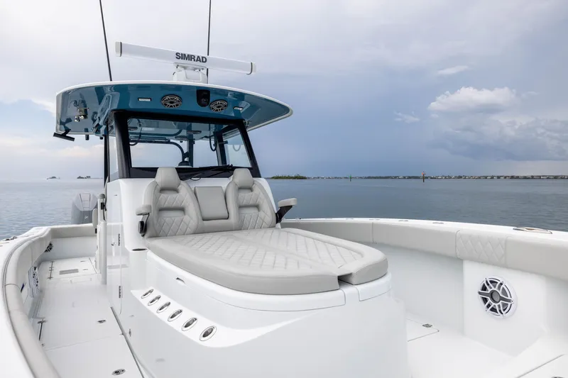 Slide: The Image of 2025 Freeman 35 boat with luxurious seating and advanced navigation system on calm waters. - 17