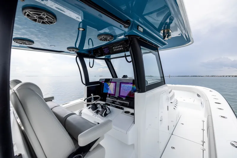 Slide: The Image of 2025 Freeman 35 boat interior with advanced navigation system and sleek design on calm waters. - 29