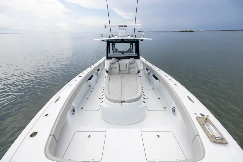 Slide: The Image of 2025 Freeman 35 boat on calm water, featuring spacious deck and modern design. - 16