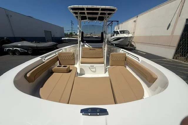 Slide: The Image of 2026 Bayliner Trophy T22CX boat with spacious seating and modern design in a marina setting. - 5