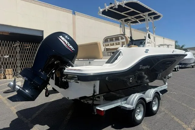 Slide: The Image of 2026 Bayliner Trophy T22CX boat on trailer with Mercury outboard motor. - 2
