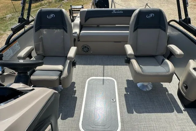 Slide: The Image of 2027 Barletta Aria 24UC boat interior with plush seating and modern design. - 13