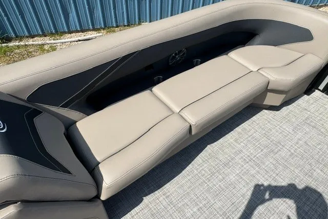 Slide: The Image of 2027 Barletta Aria 24UC boat interior with beige seating and modern design. - 11