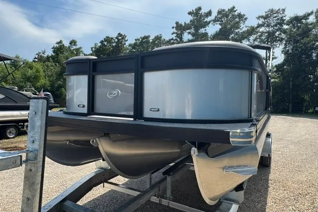 Slide: The Image of 2027 Barletta Aria 24UC pontoon boat on trailer, parked outdoors. - 8