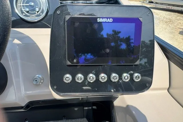 Slide: The Image of 2027 Barletta Aria 24UC dashboard featuring a Simrad display and control buttons. - 17