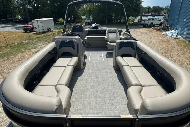 Slide: The Image of 2027 Barletta Aria 24UC pontoon boat with spacious seating and modern design. - 9