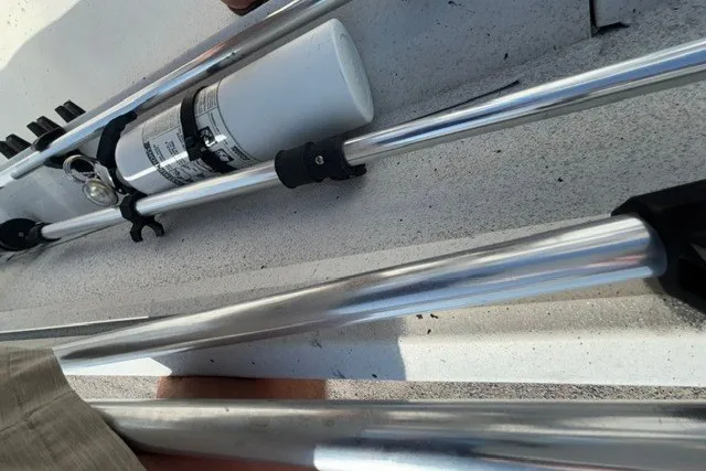 Slide: The Image of Aluminum rods and a canister secured on a 2019 G3 Bay 20 boat deck. - 19