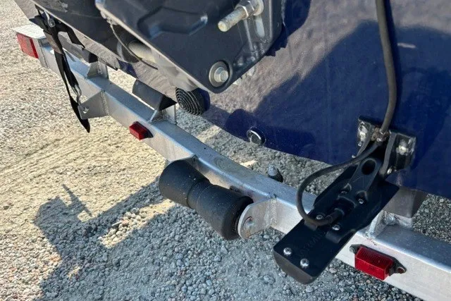 Slide: The Image of Trailer hitch and boat motor mount on 2019 G3 Bay 20, parked on gravel. - 30