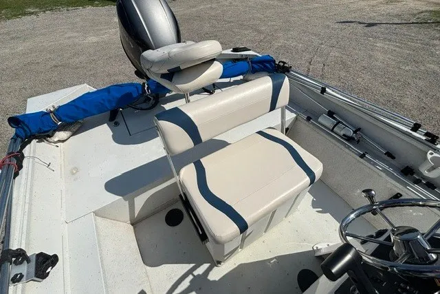 Slide: The Image of 2019 G3 Bay 20 boat interior with cushioned seating and steering wheel. - 33