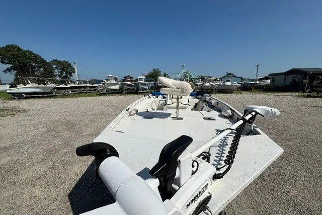 Slide: The Image of 2019 G3 Bay 20 boat in a marina, surrounded by other boats under a clear blue sky. - 24