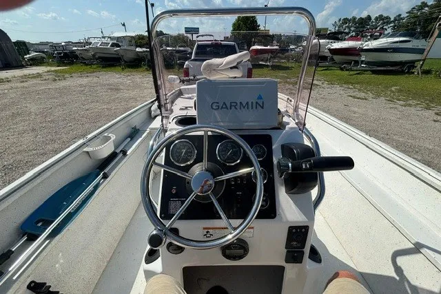 Slide: The Image of 2019 G3 Bay 20 boat dashboard with Garmin navigation system, steering wheel, and gauges. - 32