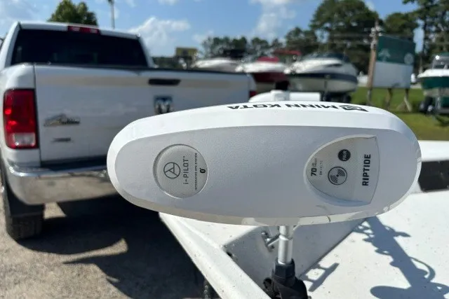 Slide: The Image of Minn Kota Riptide motor on G3 Bay 20 boat, 2019 model, with truck and boats in background. - 25