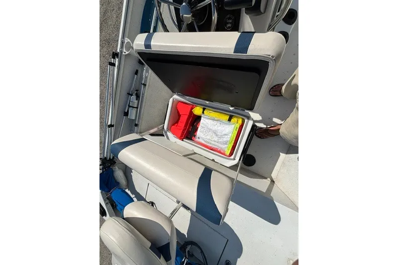 Slide: The Image of 2019 G3 Bay 20 boat interior with open storage compartment and safety gear. - 15