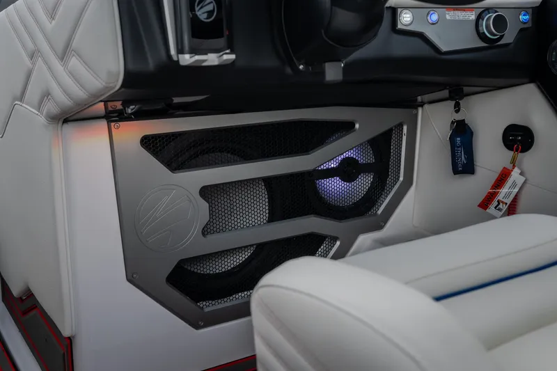 Slide: The Image of Interior of 2027 Tige Ultré 25ZX boat featuring sleek speaker system and modern design. - 25