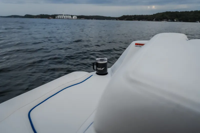 Slide: The Image of Tigé Ultré 25ZX boat on water, featuring sleek white seating, 2027 model. - 51
