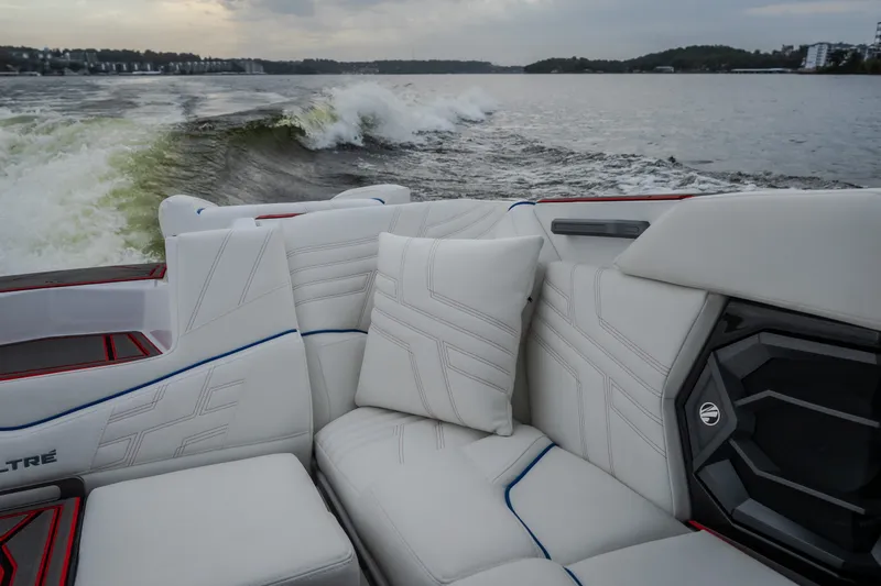 Slide: The Image of Luxurious interior of 2027 Tige Ultré 25ZX boat with plush seating on a lake. - 15