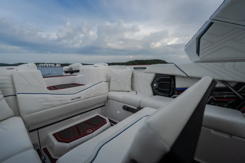 Slide: The Image of 2027 Tige Ultré 25ZX boat interior with luxurious white seating and modern design. - 11