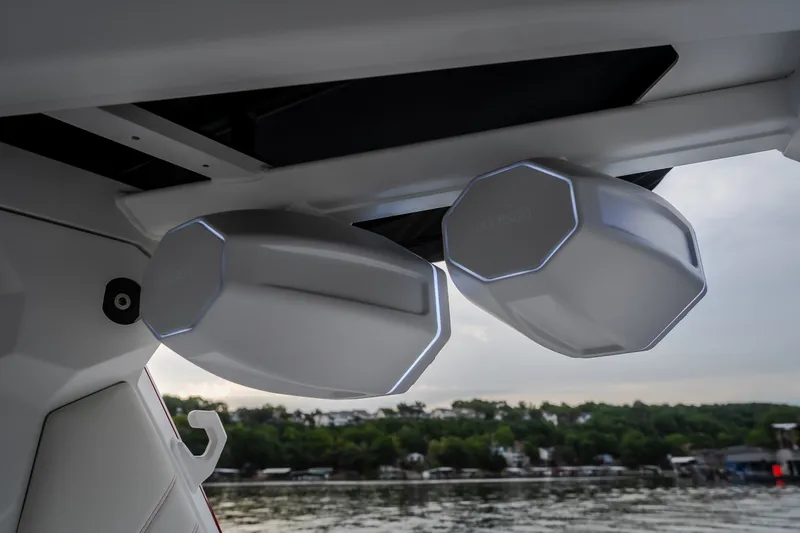 Slide: The Image of 2027 Tigé Ultré 25ZX boat speakers with sleek design, overlooking a serene waterfront. - 61