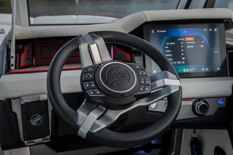 Slide: The Image of Steering wheel and dashboard of 2027 Tige Ultré 25ZX boat with touchscreen controls. - 21