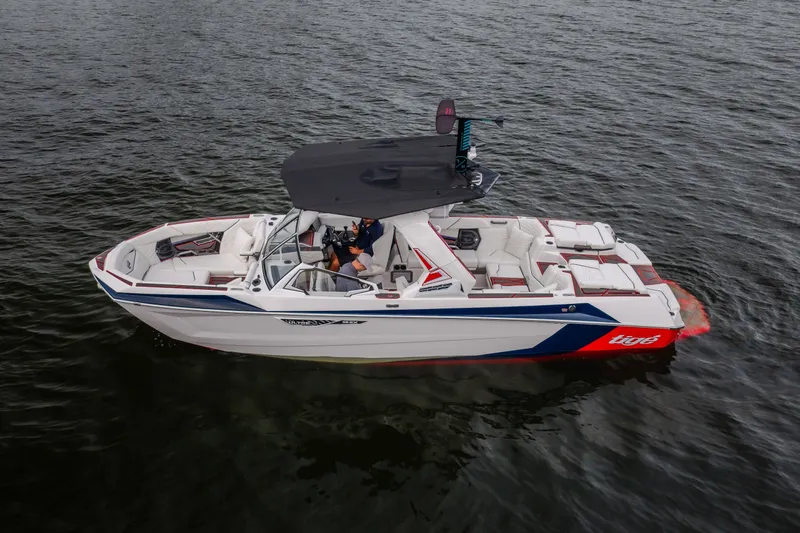 Slide: The Image of 2027 Tige Ultré 25ZX boat on water, featuring sleek design and spacious seating. - 4