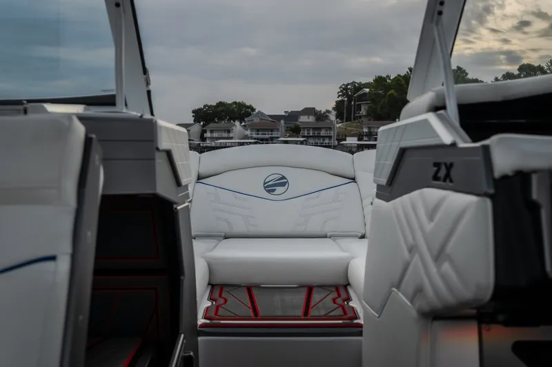 Slide: The Image of 2027 Tige Ultré 25ZX boat interior with luxurious white seating and modern design. - 26
