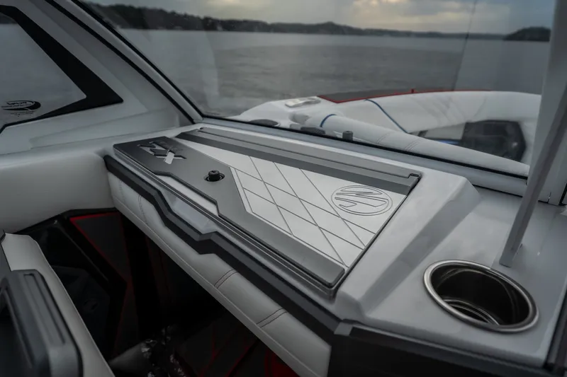 Slide: The Image of Interior of 2027 Tigé Ultré 25ZX boat, featuring sleek dashboard design. - 57