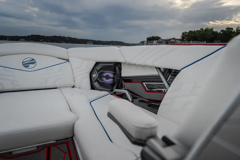 Slide: The Image of Luxurious interior of 2027 Tigé Ultré 25ZX boat with white seating and speaker system. - 64