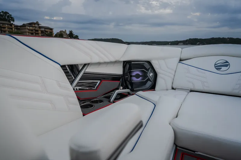 Slide: The Image of Luxurious interior of 2027 Tigé Ultré 25ZX boat with sleek white seating and speaker system. - 65