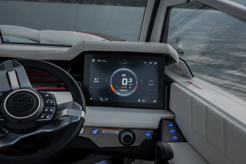 Slide: The Image of Dashboard of 2027 Tige Ultré 25ZX boat with digital display and steering wheel. - 24