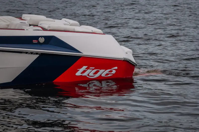 Slide: The Image of 2027 Tige Ultré 25ZX boat on water, showcasing sleek design and vibrant colors. - 5