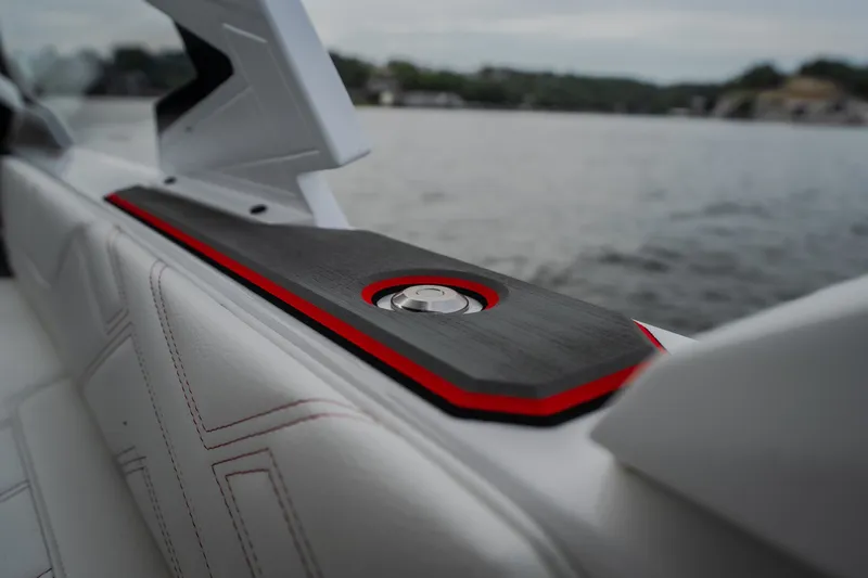 Slide: The Image of 2027 Tigé Ultré 25ZX boat interior detail with sleek design and red accents. - 56