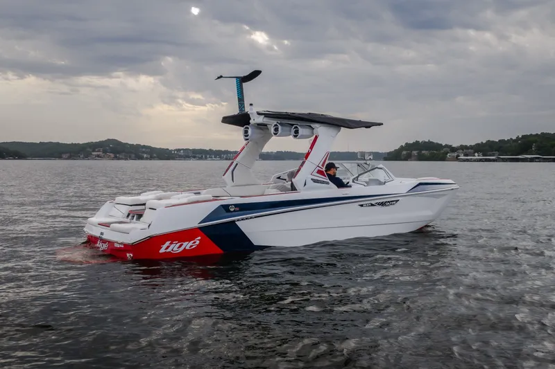 Slide: The Image of 2027 Tige Ultré 25ZX boat on a lake under cloudy skies. - 10