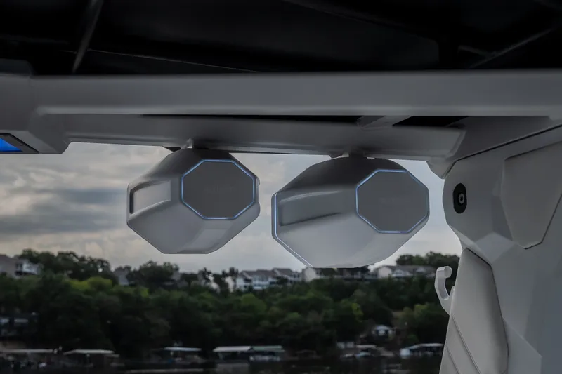 Slide: The Image of Speakers on a 2027 Tige Ultré 25ZX boat with a scenic background. - 34