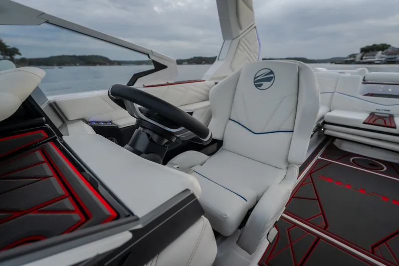 Slide: The Image of Luxury interior of 2027 Tigé Ultré 25ZX boat with sleek steering and seating. - 67