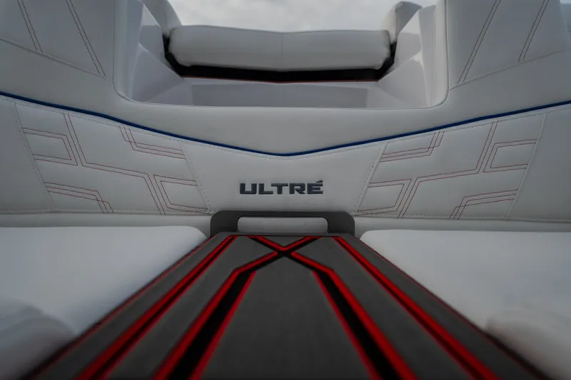 Slide: The Image of Interior of 2027 Tige Ultré 25ZX boat with stylish white and red upholstery. - 35