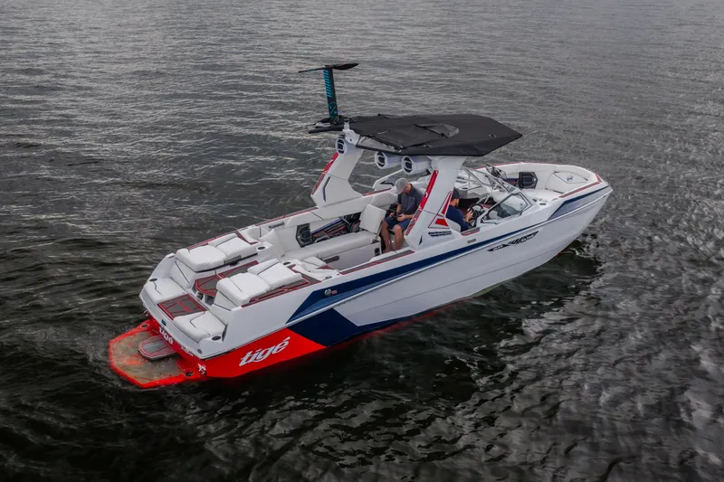Slide: The Image of 2027 Tige Ultré 25ZX boat on water, featuring sleek design and spacious seating. - 3