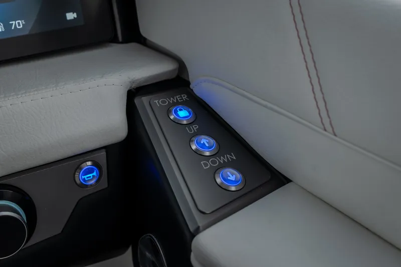 Slide: The Image of Control panel of 2027 Tige Ultré 25ZX boat with illuminated buttons. - 22