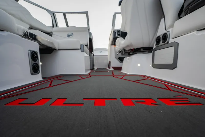 Slide: The Image of 2027 Tige Ultré 25ZX boat interior with sleek seating and modern design. - 27