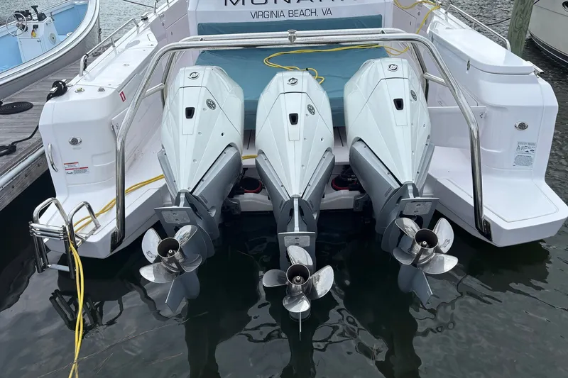 Slide: The Image of Triple outboard engines on a 2023 Axopar 45 XC Cross Cabin boat in Virginia Beach. - 28