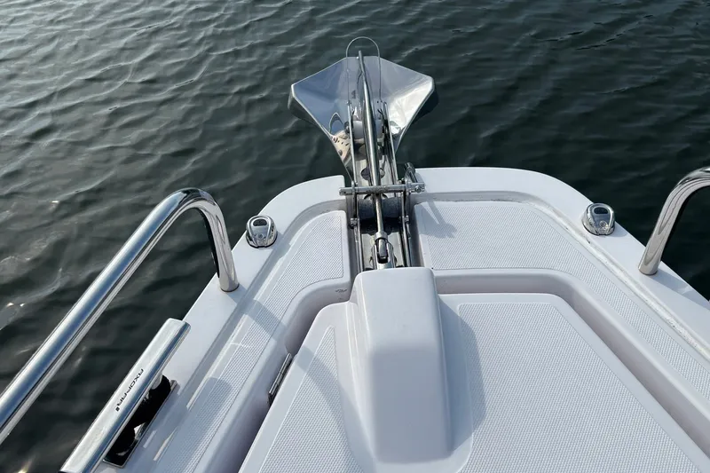 Slide: The Image of Bow view of 2023 Axopar 45 XC Cross Cabin on water. - 30
