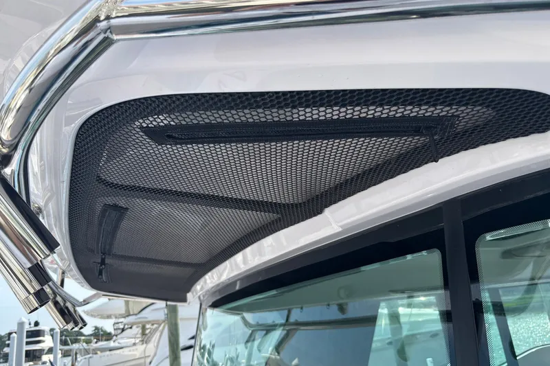 Slide: The Image of 2023 Axopar 45 XC Cross Cabin roof detail with mesh storage compartment. - 37