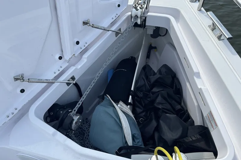 Slide: The Image of Storage compartment of 2023 Axopar 45 XC Cross Cabin with anchor chain and gear. - 32