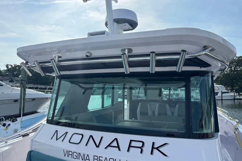 Slide: The Image of 2023 Axopar 45 XC Cross Cabin boat docked in Virginia Beach marina. - 40