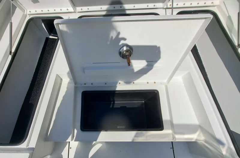 Slide: The Image of An open storage compartment on a boat with a lock and key. - 19